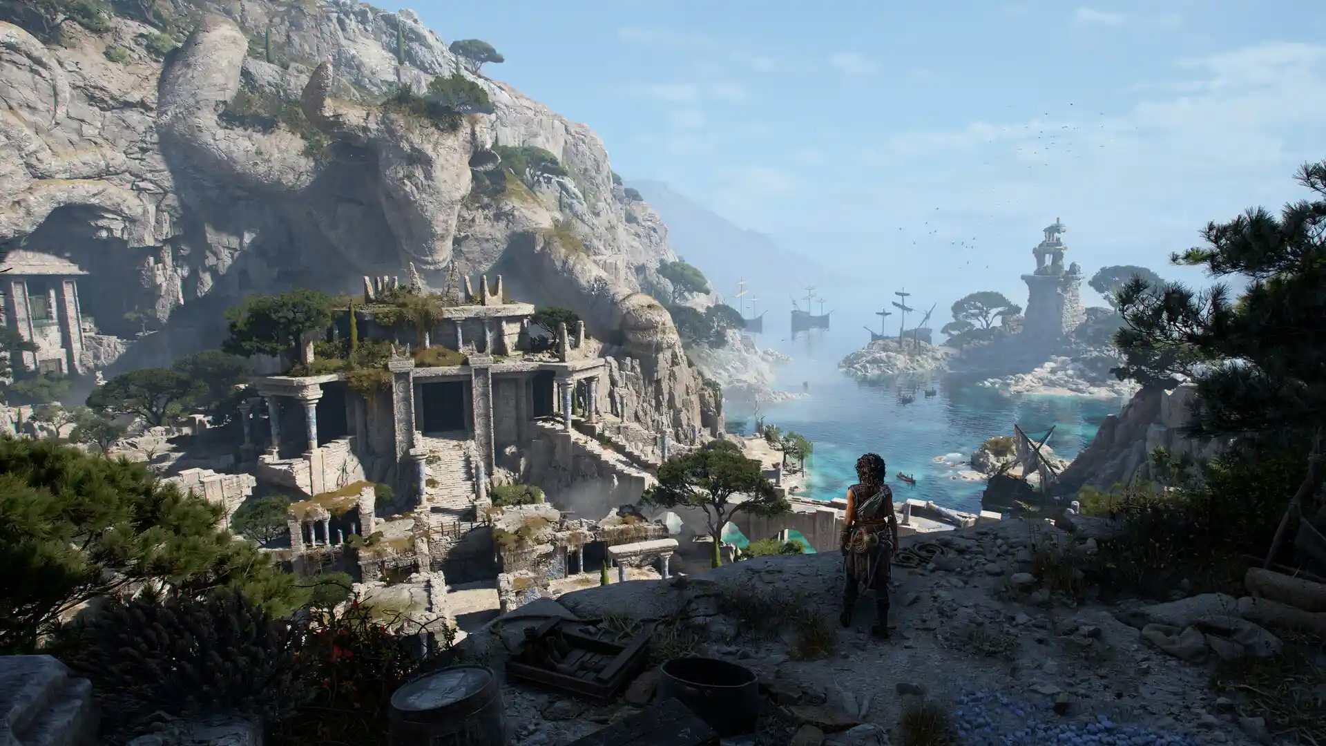 Sophia looking out over a landscape from a cliff near a harbor