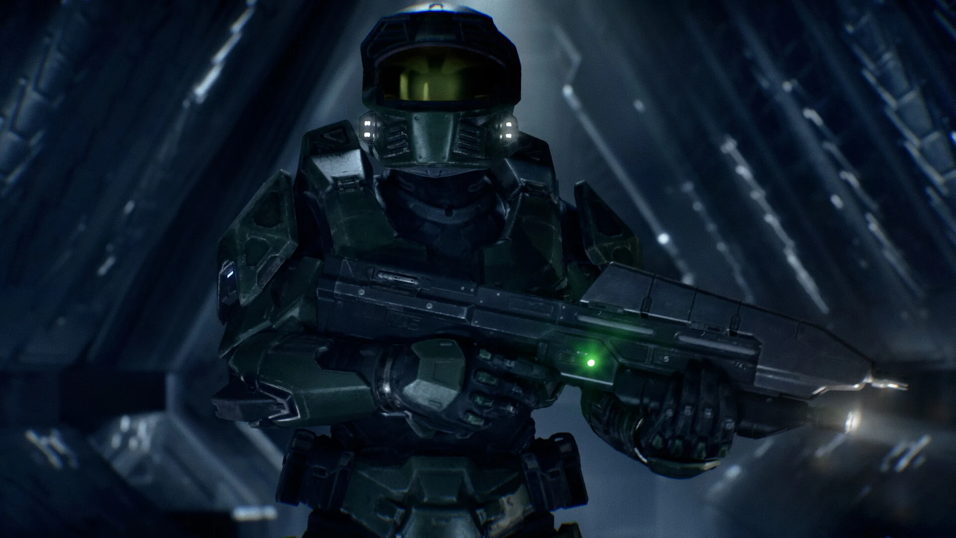 Master Chief walking down a dark Covenant corridor
