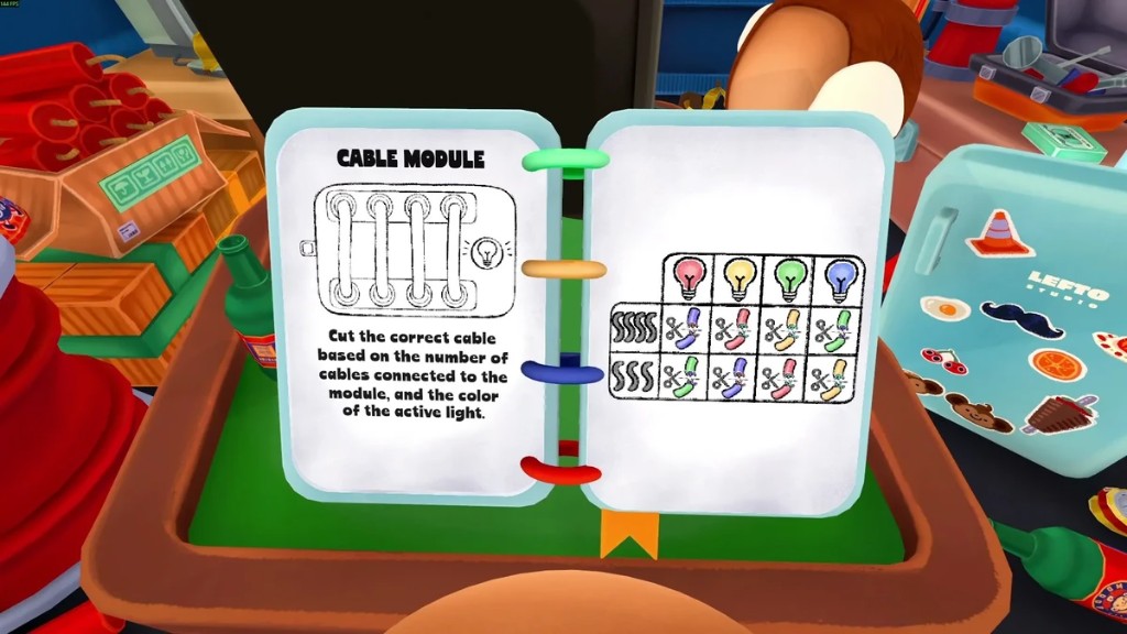 Spiral-bound cable module manual on the green table with color and light reference chart